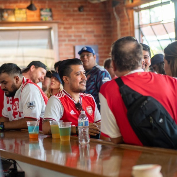 Arsenal fans sitting at the bar