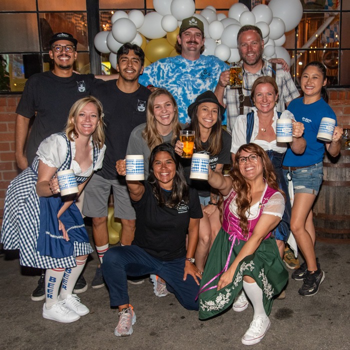 Group of people dressed in Oktoberfest outfits